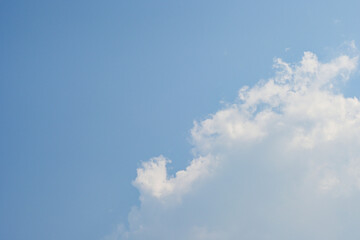 beautiful blue sky and white fluffy cloud with sunrise in the morning, natural background