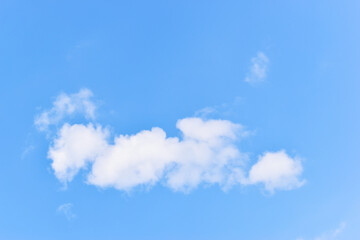 beautiful blue sky and white fluffy group of clouds with sunrise in the morning, natural background