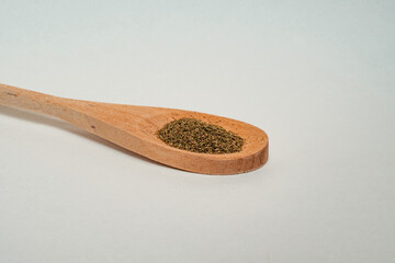 Wooden spoons filled with spices in different positions