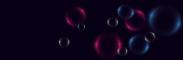 Abstract background with neon bubbles, iridescent colorful glass balls or spheres on a black background.