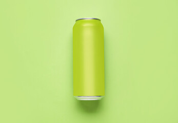 Can of soda on green background
