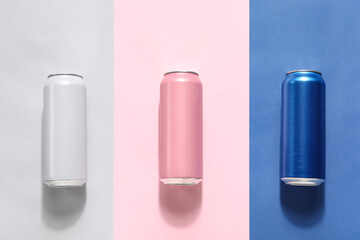 Cans of fresh soda on color background