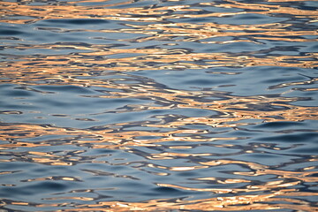 Sunset light water reflexions before night