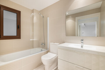 Fototapeta na wymiar Light, minimalist bathroom with sink, cabinet and mirror in the bath. The concept of a comfortable compact bathroom in a new building or an apartment after renovation