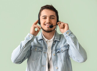 Male technical support agent on mint background