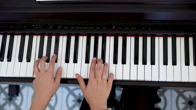 Musical Brilliance: Close-Up of Young Pianist's Skillful Hands