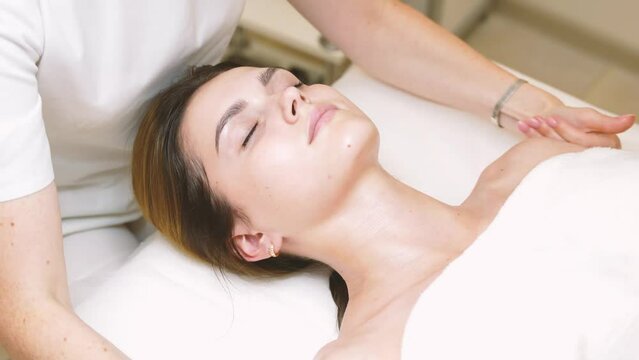 Lymphatic drainage, face lifting massage by professional massage therapist