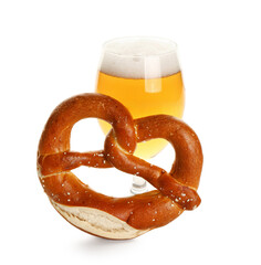 Glass of cold beer and pretzel on white background. Oktoberfest celebration