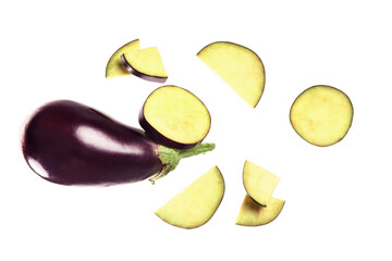 Flying fresh eggplant and cut pieces on white background
