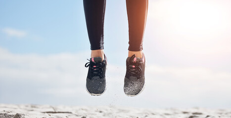 Woman, fitness and shoes in jump on mockup for sports motivation, running or outdoor exercise....