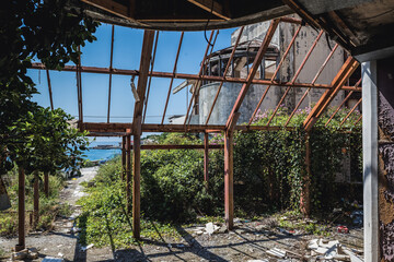 Fototapeta na wymiar Ruined hotel in so called Bay of Abandoned Hotels in Kupari, Croatia