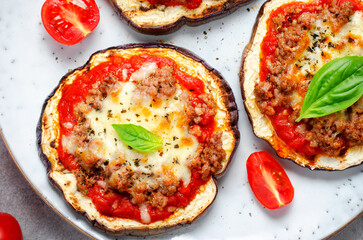 Eggplant Pizza with Tomato Sauce, Minced Meat, Mozzarella and Basil, Mini Vegetable Pizza over Bright Background