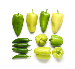 Different fresh peppers on white background