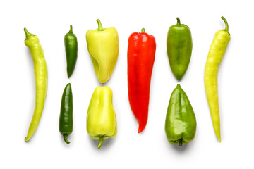 Different fresh peppers on white background