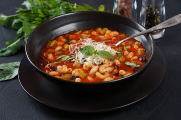 A bowl of minestrone soup with mix of vegetables. Italian cuisine