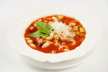 A bowl of minestrone soup with mix of vegetables. Italian cuisine