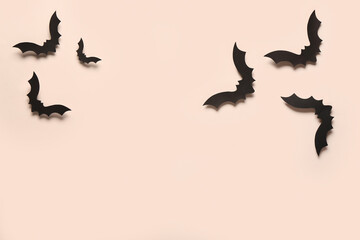 Paper bats for Halloween party on light background