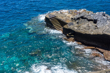 waves crashing on rocks