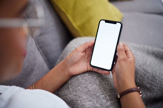 Screen, mockup and hands of woman with phone on a couch for ux, internet and web search on social media. Website, smartphone and person relax on a sofa with mobile connection or online shopping