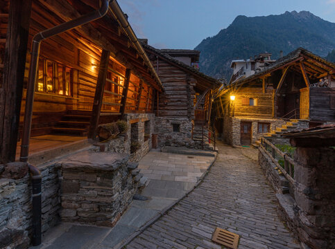 The rural architecture of Alagna village in the Valsesia valley range at dusk - Italy.