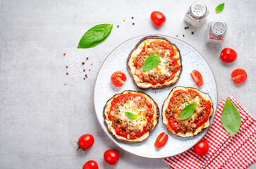 Eggplant Pizza with Tomato Sauce, Minced Meat, Mozzarella and Basil, Mini Vegetable Pizza over Bright Background