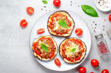 Eggplant Pizza with Tomato Sauce, Minced Meat, Mozzarella and Basil, Mini Vegetable Pizza over Bright Background