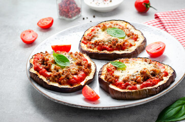 Eggplant Pizza with Tomato Sauce, Minced Meat, Mozzarella and Basil, Mini Vegetable Pizza over Bright Background