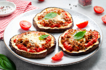 Eggplant Pizza with Tomato Sauce, Minced Meat, Mozzarella and Basil, Mini Vegetable Pizza over Bright Background