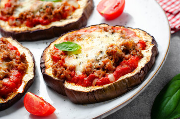 Eggplant Pizza with Tomato Sauce, Minced Meat, Mozzarella and Basil, Mini Vegetable Pizza over Bright Background