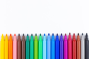 Multi-colored felt tip pens on white background. Back to school colorful banner. Copy space.