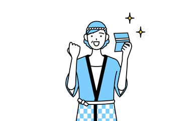 預金通帳を見て喜ぶ夏祭りの法被を着たシニア女性