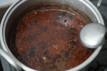 Rawon is an Indonesian beef soup. Originating from East Java, rawon utilizes the black keluak nut as the main seasoning, which gives a dark color and nutty flavor to the soup.