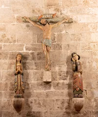  VALENCIA, SPAIN - FEBRUARY 14, 2022: The calvary sculptural group in the church Iglesia San Juan del Hospital by  unknown artist of 12. cent.. © Renáta Sedmáková