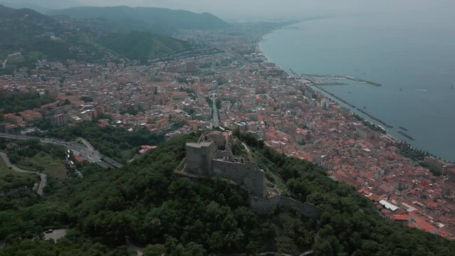 aerial view from the drone of the Gulf of Salerno with its commercial port, the crystal clear sea, the castle of Arechi, Piazza of Libert&agrave;