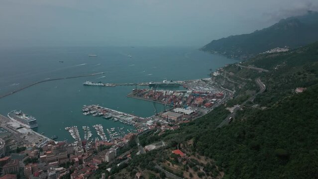 aerial view from the drone of the Gulf of Salerno with its commercial port, the crystal clear sea, the castle of Arechi, Piazza of Libert&agrave;
