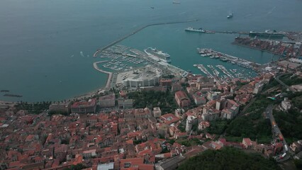 aerial view from the drone of the Gulf of Salerno with its commercial port, the crystal clear sea, the castle of Arechi, Piazza of Libertà