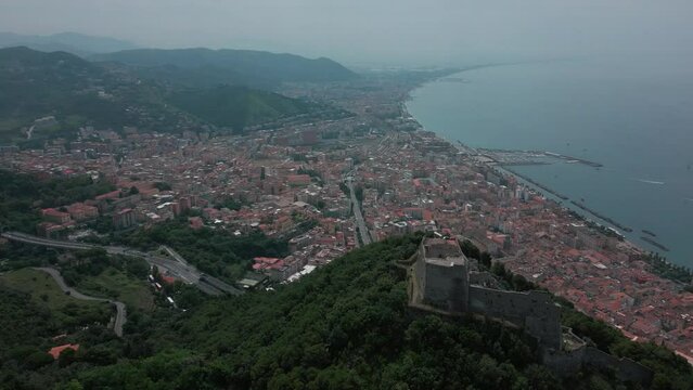 aerial view from the drone of the Gulf of Salerno with its commercial port, the crystal clear sea, the castle of Arechi, Piazza of Libert&agrave;