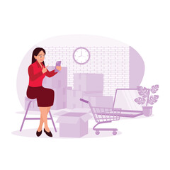 Asian female freelancer checking mobile phone and working on laptop, ready to pack orders. SME e-commerce online concept. Trend Modern vector flat illustration