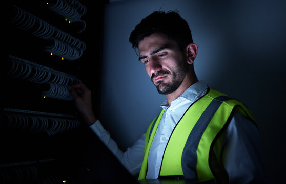 Engineer man, thinking and night in server room for information technology, maintenance and check cables . IT technician, cyber security and ideas for inspection, analytics and dark in data center