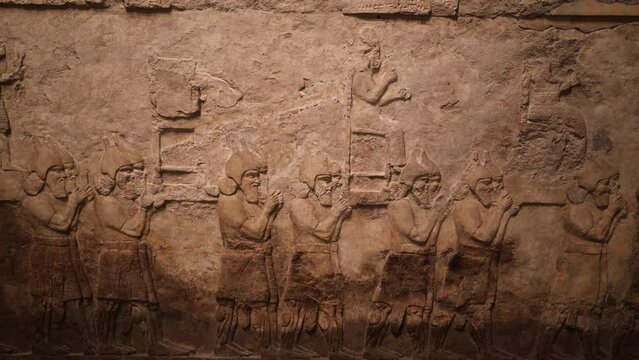 Ancient Assyrian Wall Panel Relief Depicting the Removal of Enemy Gods