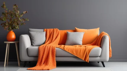 Foto op Plexiglas orange blanket on grey sofa modern, generative ai © Creative Station