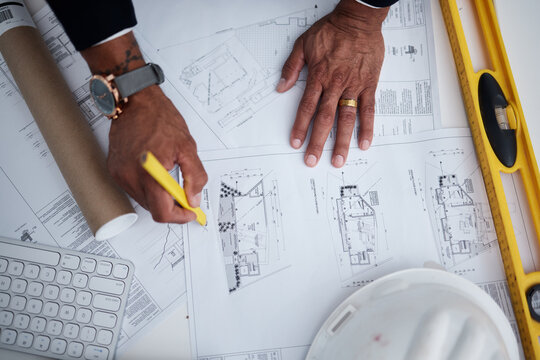 Top view of man, hands or engineering with blueprint, construction process or design illustration. Closeup of architect drawing documents, floor plan development or stationery tools to sketch project