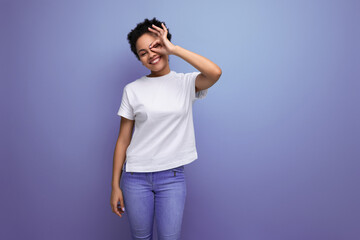 Obraz premium portrait of authentic beautiful young brunette hispanic woman in white t-shirt on background with copy space