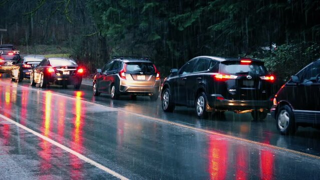 Cars Passing In The Rain In Rural Area
