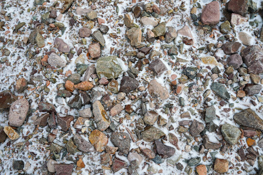 stones on the ground in winter with snow. Close up view. High quality photo