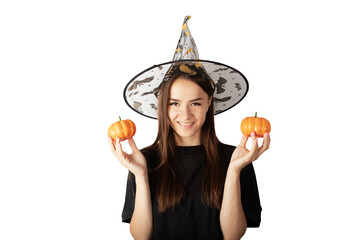 young woman teenager with halloween pumpkins in witch hat and halloween costume isolated