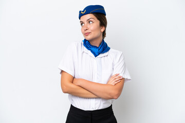 Airplane stewardess caucasian woman isolated on white background making doubts gesture while lifting the shoulders