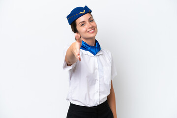 Airplane stewardess caucasian woman isolated on white background shaking hands for closing a good deal