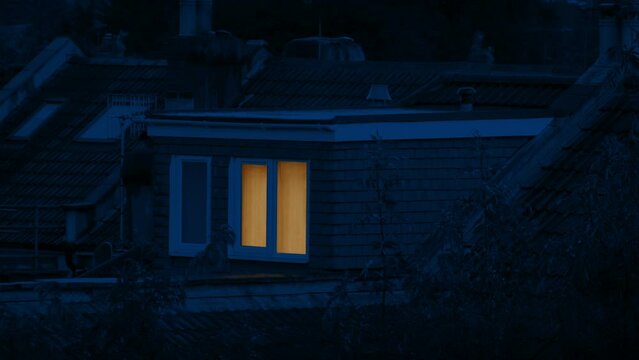 Light Comes On In Rooftop Bedroom At Night
