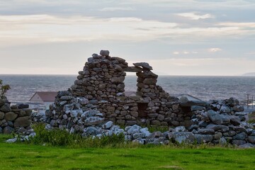 close-up of the ruins of an old farm in a green meadow in Talybont, UK © Robert